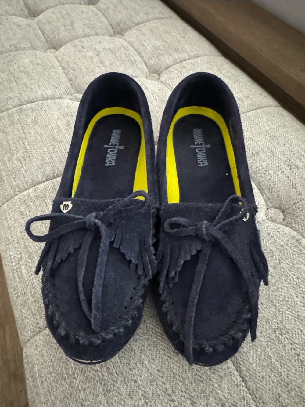 NWOT, Minnetonka navy suede moccasins . Women’s size 9